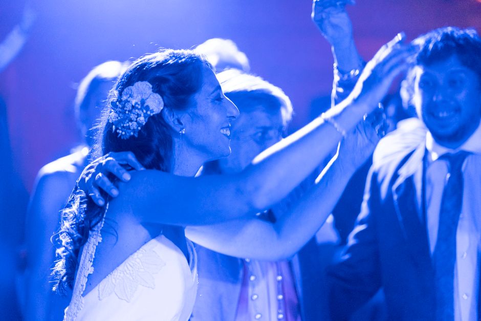 Joyful couple dancing at their wedding reception